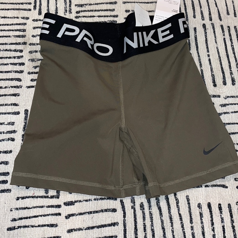 Olive green Nike pros. Size S. Brand new with tags never been born.Nice material